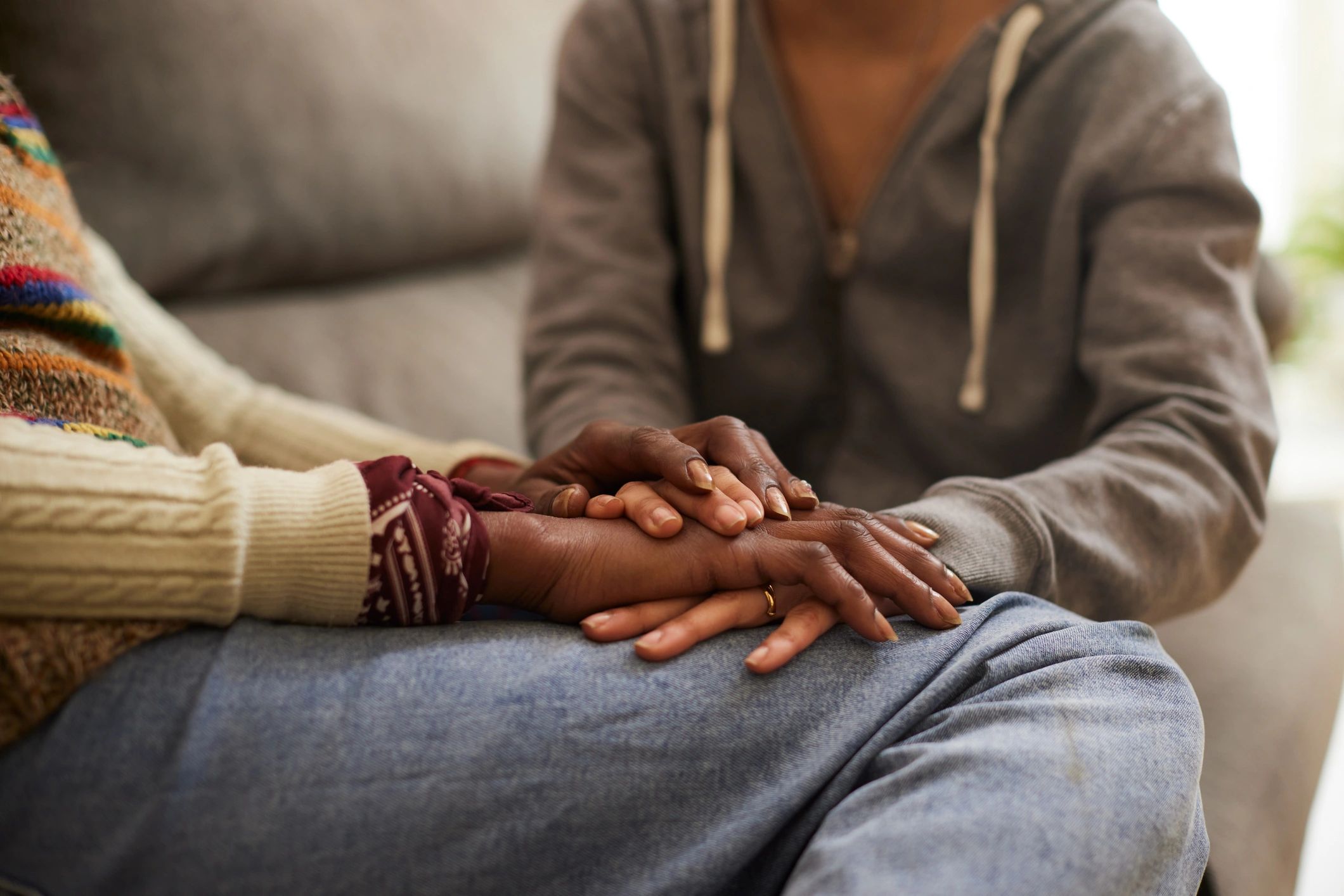 Supportive counsellor comforting a woman during a session